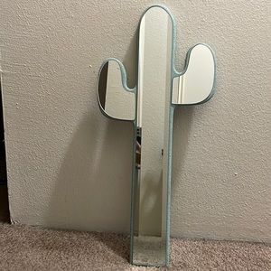 Vintage cactus mirror with a green back.